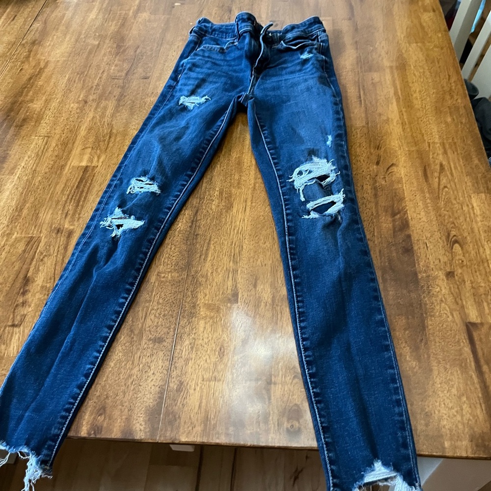 American eagle. size 0. very stretchy jeans rips are patched